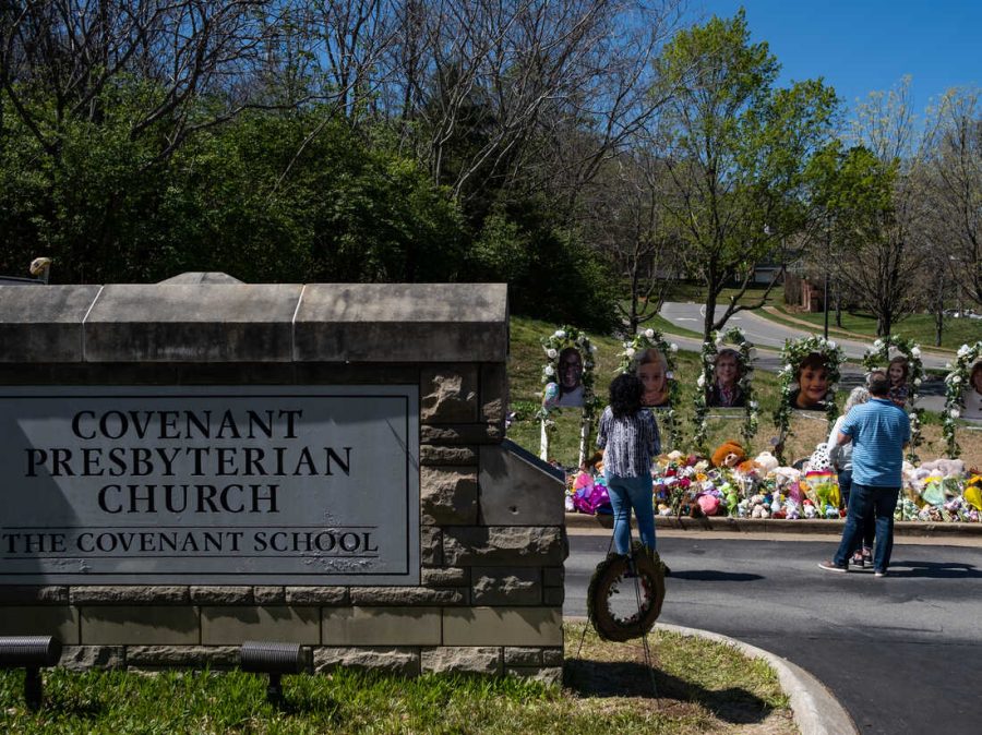 People stand in front of the school and mourn where the school shooting happened. Courtesy of Getty Images